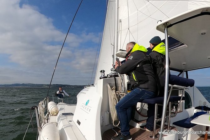 Half Day Sailing Trip - A small catamaran with room to take the helm